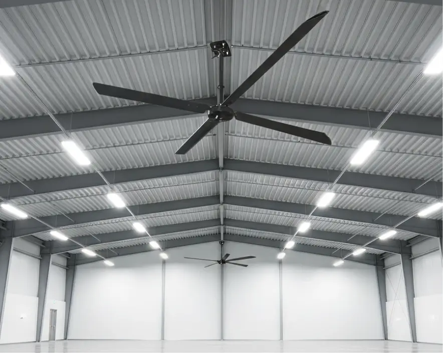 Hunter Eco 20-foot HVLS ceiling fan installed in a spacious open warehouse with vaulted metal ceilings and bright industrial lighting.