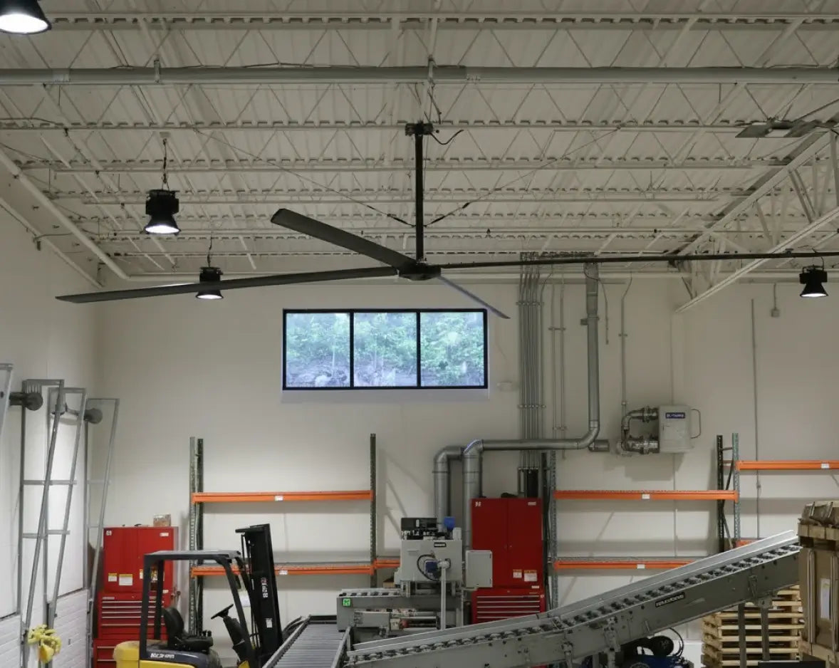 Hunter Industrial ECO HVLS fan installed in light industrial warehouse with forklift